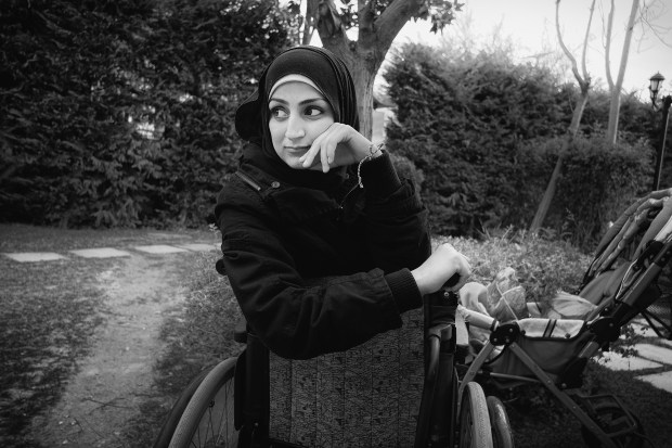 Athens: At Bethel, a retreat center and hostel in Athens run by Greek Scripture Union, Syrian and Yemeni refugees have been invited for excercise,  food, and rest before their journey toward Germany begins. This woman is in a wheelchair after being injured by a car bomb in Syria.
