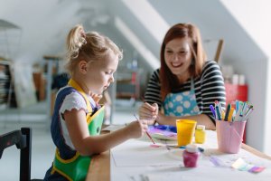 Phaedra Taylor in her home studio with 4-year-old daughter, Blythe