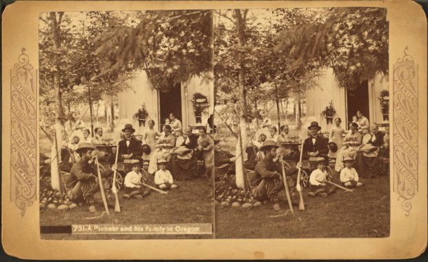 A pioneer family poses at their home in Oregon.