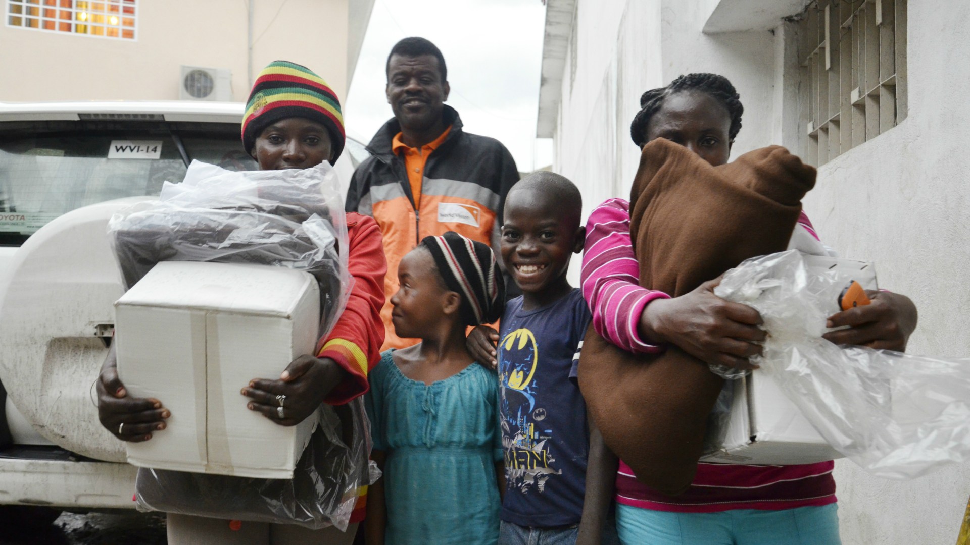 World Vision response manager Lesly Michaud with two displaced mothers and their children.