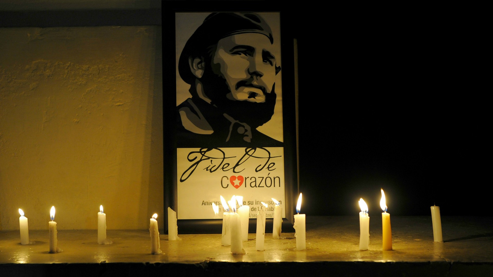 Havana residents light candles in honor of Fidel Castro.