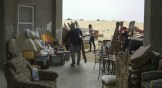 A Christian who fled ISIS brings belongings into the Evangelical Church in Ismailia.