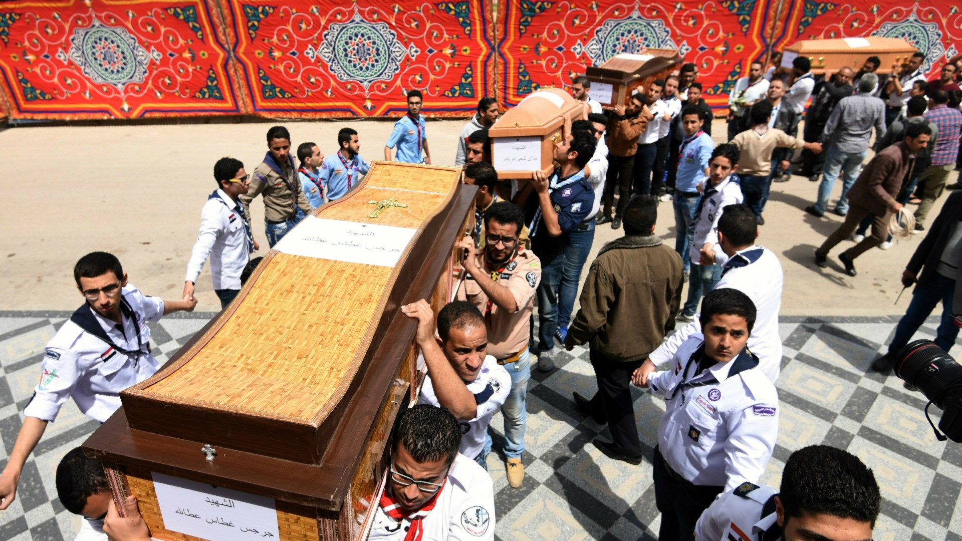 Coffins are carried to the funeral of Egyptian Christians killed in Palm Sunday bombings.