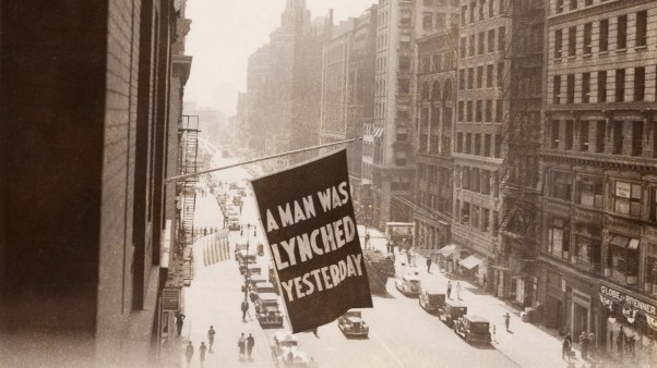 A flag announcing another lynching flies from the window of the NAACP headquarters in New York City in 1936.