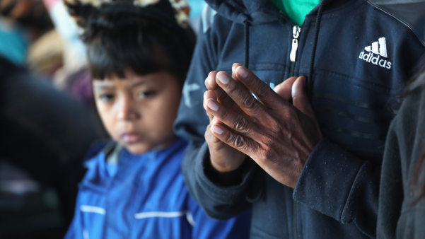 Immigrants from Central America worship at a respite center in McAllen, Texas.