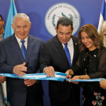 Israeli Prime Minister Benjamin Netanyahu and Guatemalan President Jimmy Morales cut the ribbon during the inauguration ceremony of the Guatemalan embassy in Jerusalem.