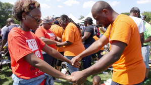 Pastor Chris Butler (right), who intervened in the housing allowance lawsuit, during a prayer walk in Chicago.