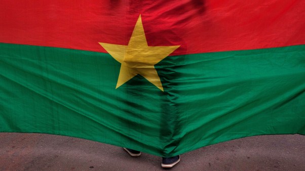 A Burkina Faso flag at a memorial service after a 2016 terrorist attack.