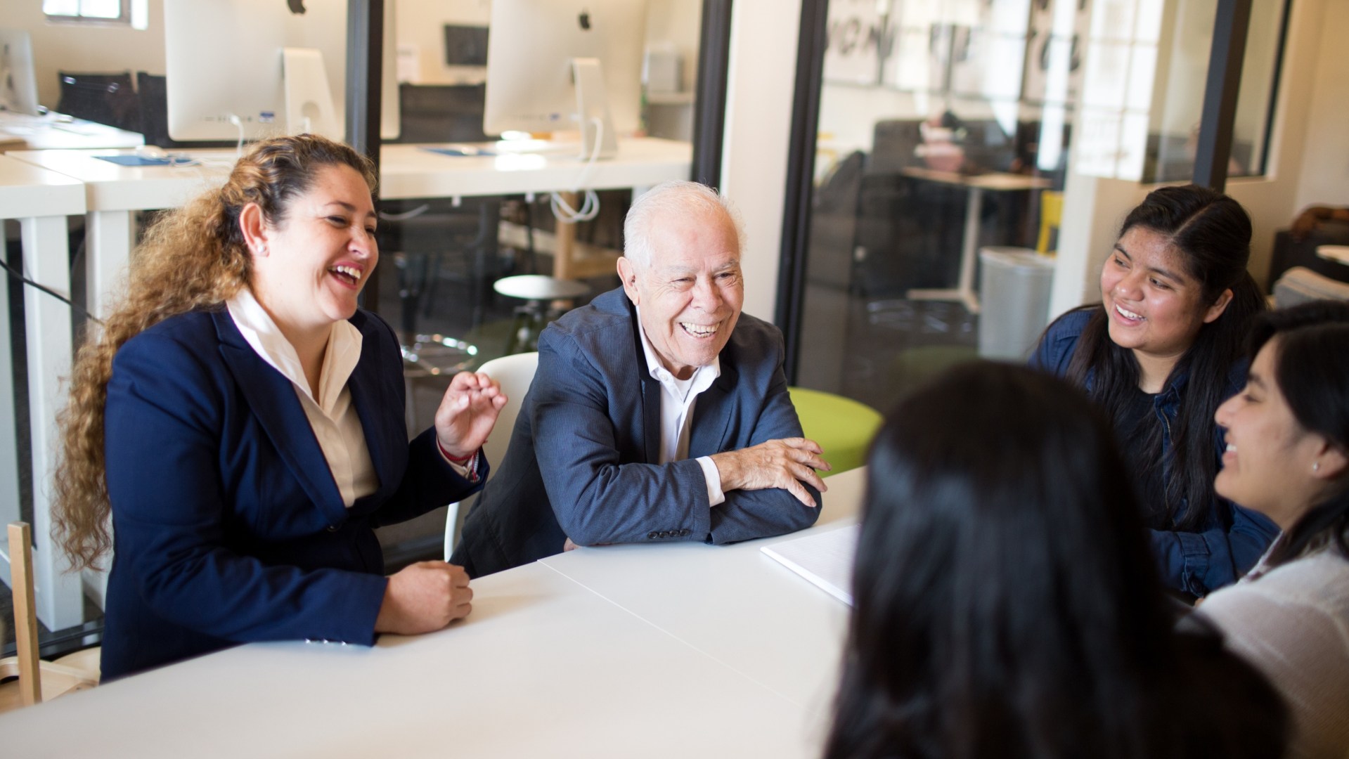 Jesse Miranda is pictured with Itzel Calleja-Macias, assistant professor of biology and director of the Jesse Miranda Center for Hispanic Leadership, along with Vanguard students who receive educational support through the Center.