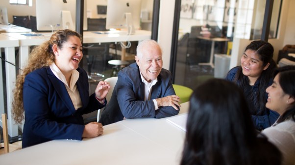 Jesse Miranda is pictured with Itzel Calleja-Macias, assistant professor of biology and director of the Jesse Miranda Center for Hispanic Leadership, along with Vanguard students who receive educational support through the Center.