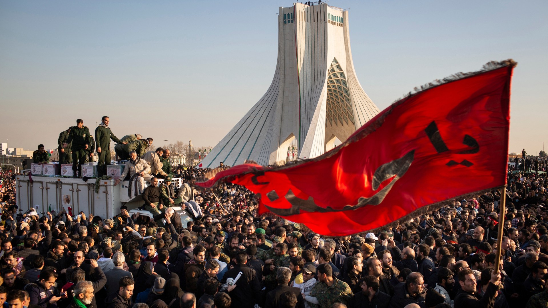 Iranian mourners attend the funeral procession of military commander Qassem Soleimani in Tehran on January 6.