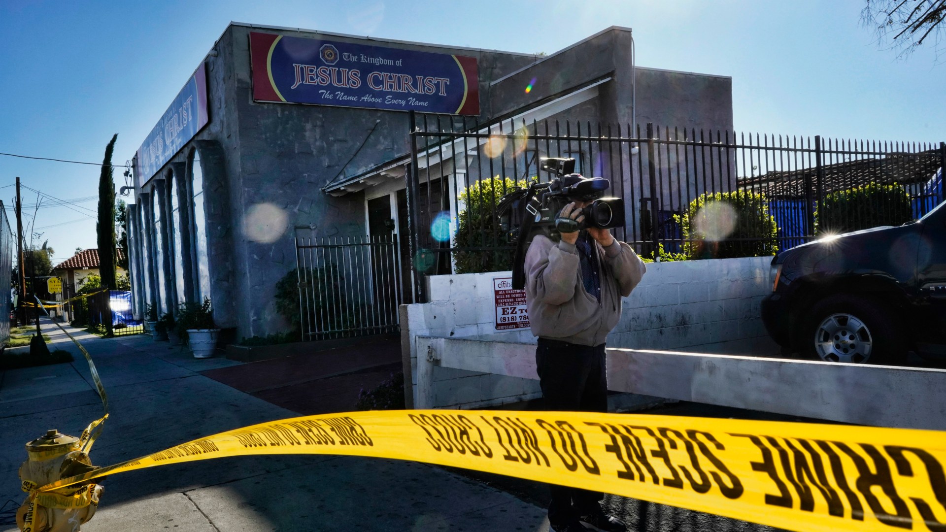 Crime scene tape is seen closing off an area around the grounds of the Kingdom of Jesus Christ Church in the Van Nuys section of Los Angeles on Wednesday, Jan. 29, 2020.