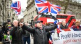 Pro-Brexit supporters wave Union Jack flags at Parliament Square as people prepare for Brexit on January 31, 2020 in London, United Kingdom.