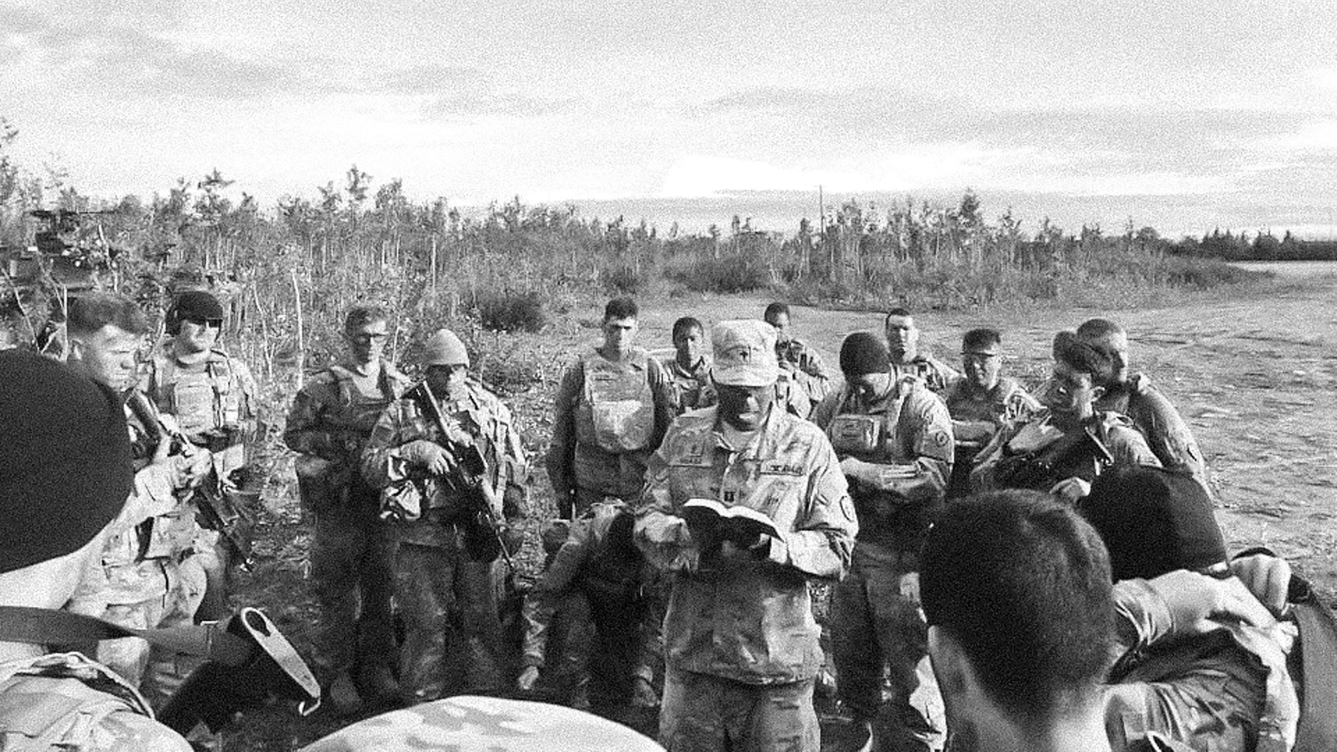 Chaplain Cornelius Muasa leads US soldiers in worship.
