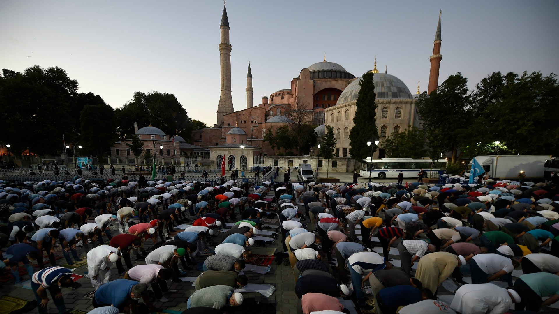 Muslims offer evening prayers outside the Byzantine-era Hagia Sophia, one of Istanbul's main tourist attractions, following the decision to reconvert it into a mosque on July 10.