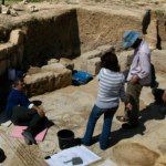 Israeli archaeologists clean a mosaic in the ruins of a church that dates back to the Byzantine period.