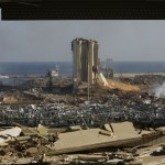 Smoke rises above wrecked buildings at Beirut's port, devastated by an explosion a day earlier, on August 5 in Lebanon's capital.