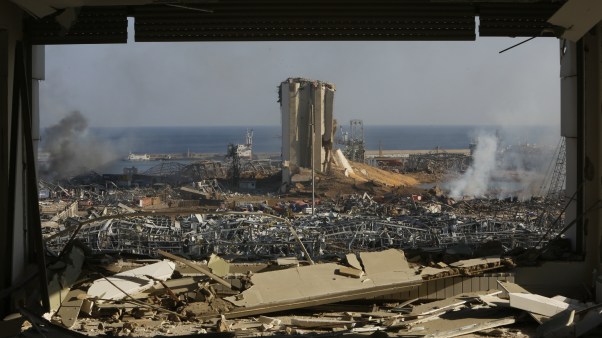 Smoke rises above wrecked buildings at Beirut's port, devastated by an explosion a day earlier, on August 5 in Lebanon's capital.