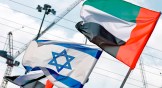 The flags of Israel and the UAE line a road in the Israeli coastal city of Netanya on August 16, 2020.