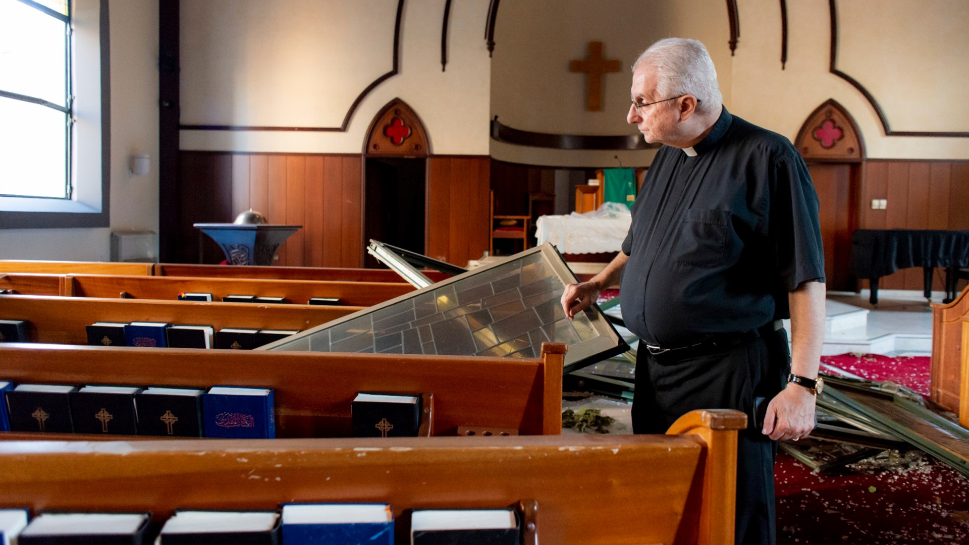 The pastor of National Evangelical Church surveys the damage from the Beirut explosion.