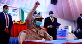 Lieutenant general Mohamed Hamdan Dagalo of Sudan holds up a pen before signing a peace deal with rebel groups on August 31.
