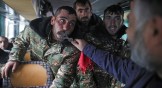 A priest blesses Armenian volunteers and mobilized military personnel ahead of their deployment to the Nagorno-Karabakh front line on October 6.