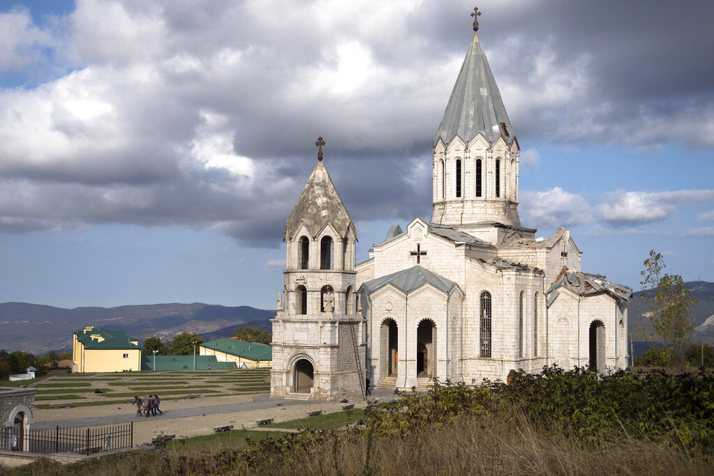Men carry out furniture from the Holy Savior Cathedral damaged by shelling during a military conflict, in Shushi, outside Stepanakert, self-proclaimed Republic of Nagorno-Karabakh on October 8.