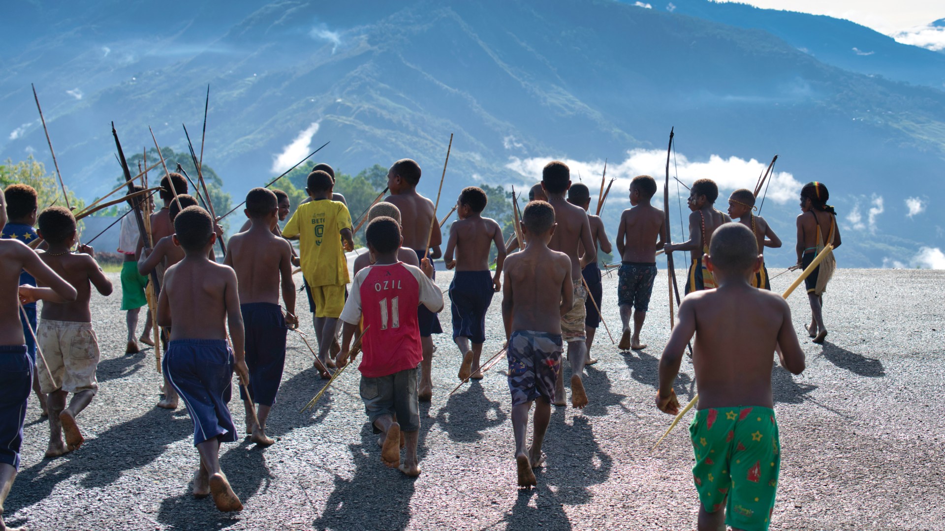 Lani children run down the alpine runway at Mamit, the destination of MAF pilot Joyce Lin on her fateful flight.