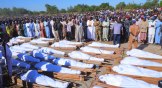 People attend a funeral for those killed by suspected Boko Haram militants in Zaabarmar, Nigeria, on November 29.