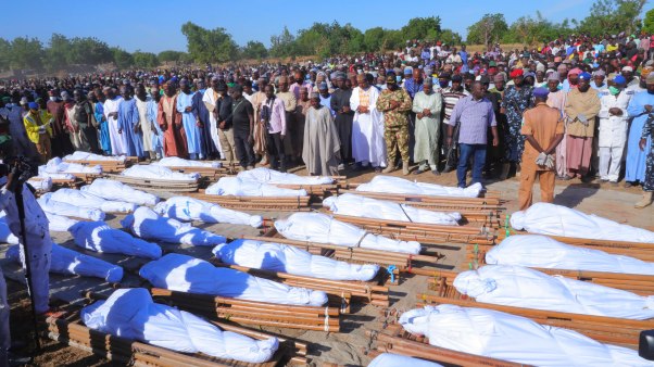 People attend a funeral for those killed by suspected Boko Haram militants in Zaabarmar, Nigeria, on November 29.