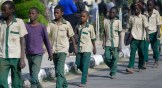 A group of Nigerian schoolboys are escorted December 18 by military and officials in Katsina following their release after they were kidnapped last week.