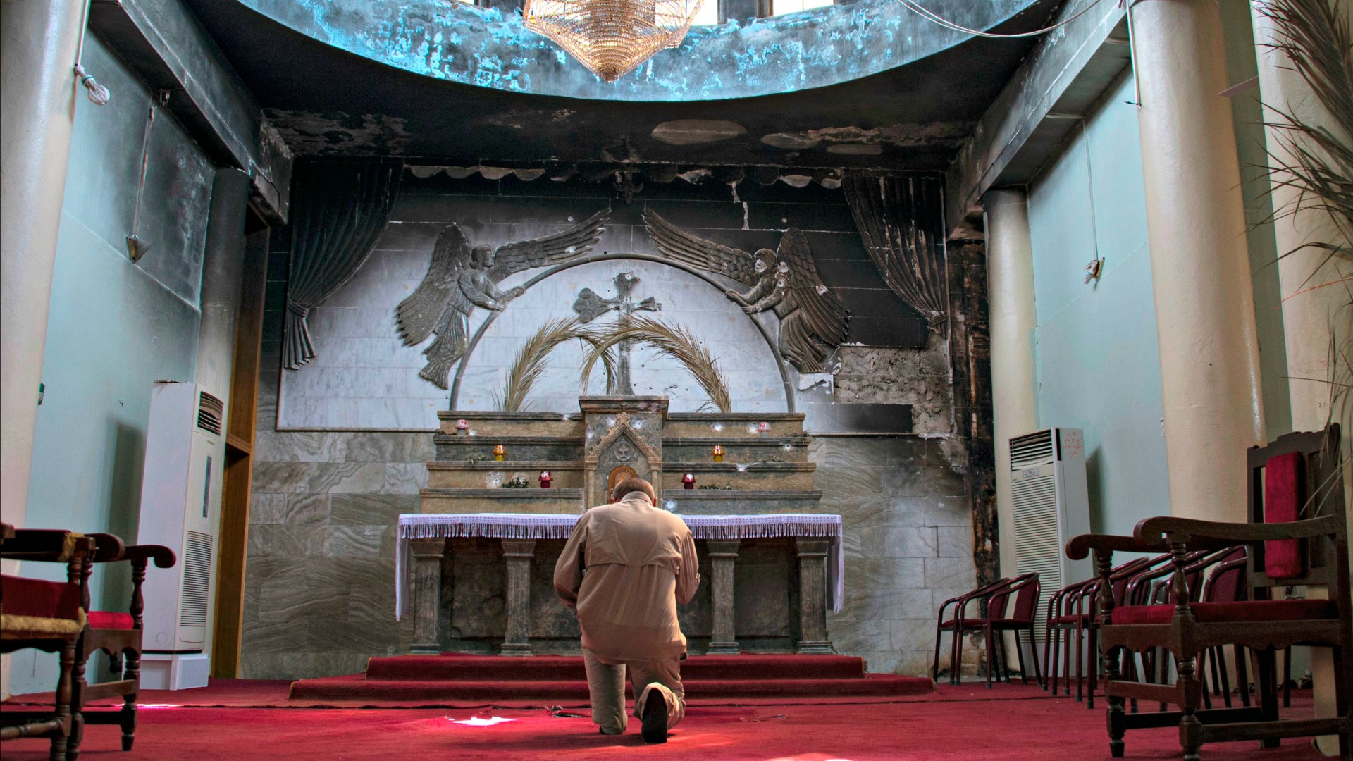 An Iraqi Christian prays in a church in Qaraqosh, a city in the Nineveh Plains near Mosul, in May 2017.