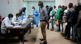 Truck drivers get screened for COVID-19 at Tanzania's border with Kenya.
