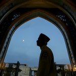 In this May 2019 file photo, a worshiper arrives at a mosque for Iftar during Ramadan in Kuala Lumpur, Malaysia.