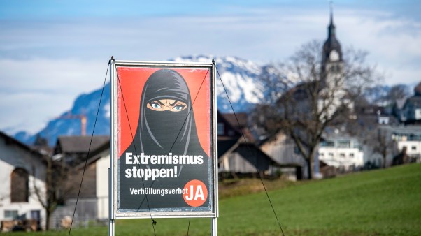A poster supporting the initiative "Yes to a ban on covering the face" is displayed in Buochs, Switzerland, on February 16, 2021.