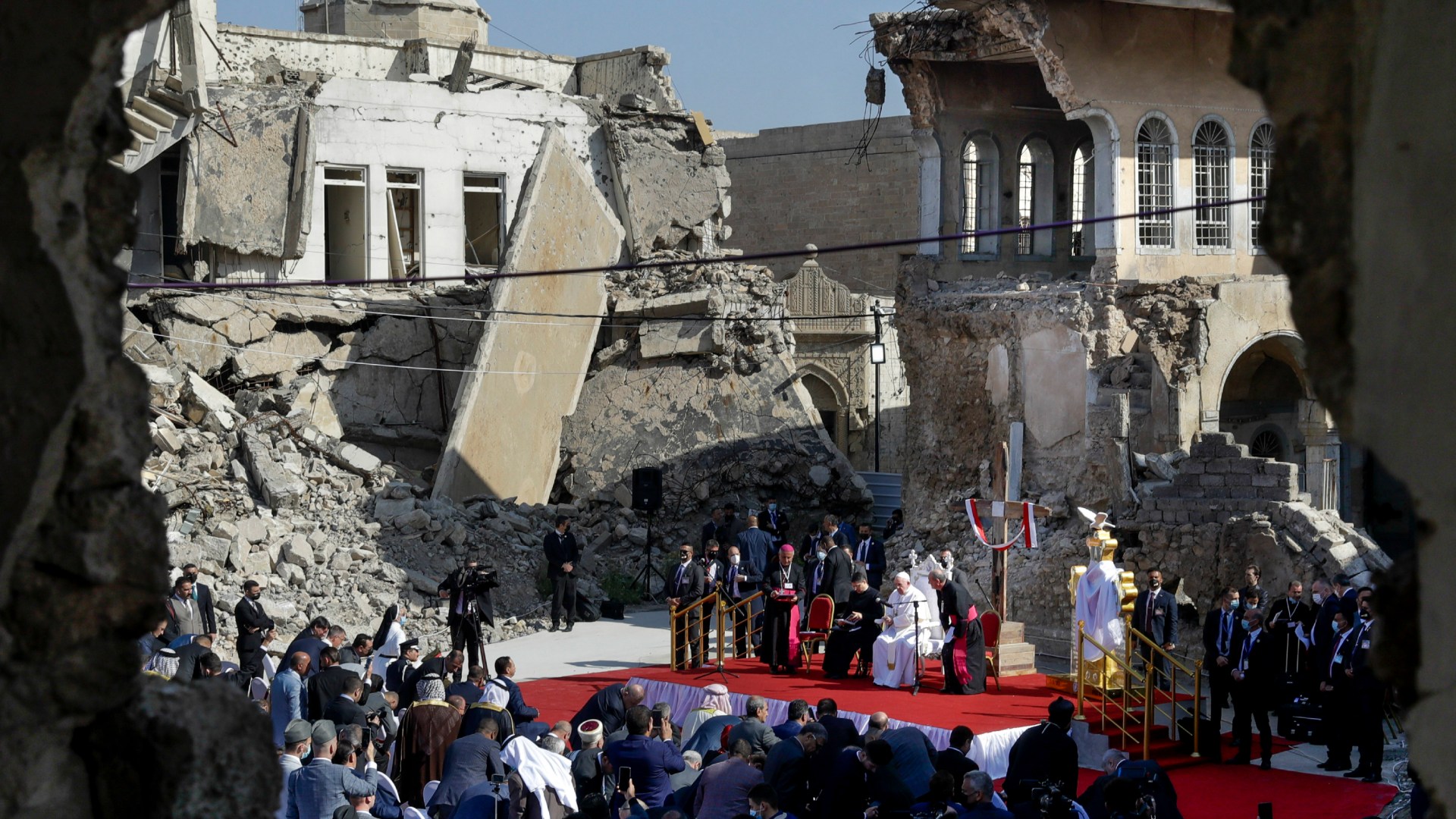 Pope Francis, surrounded by shells of destroyed churches, leads a prayer for the victims of war at Hosh al-Bieaa Church Square in Mosul, Iraq, once the de-facto capital of ISIS, on March 7, 2021.