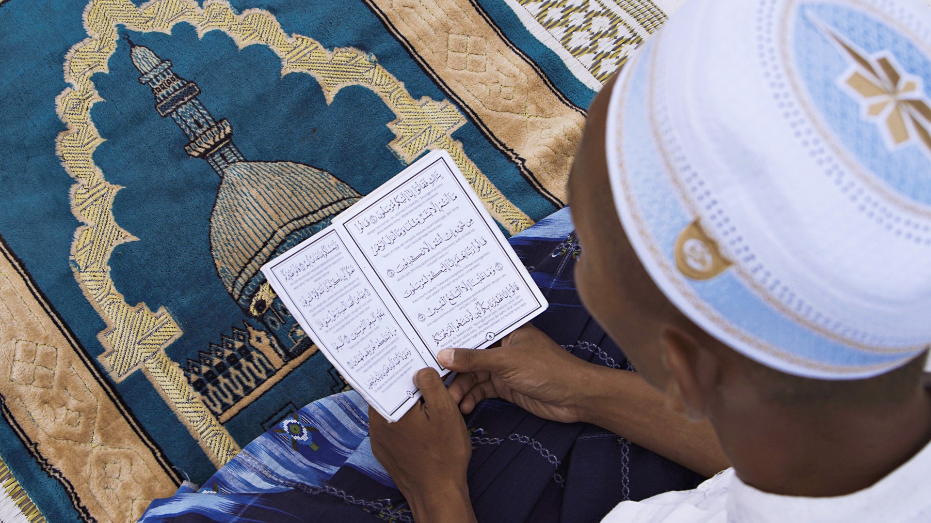 A madrasah student reads the Quran during Ramadan 2020 in Shah Alam, Malaysia.