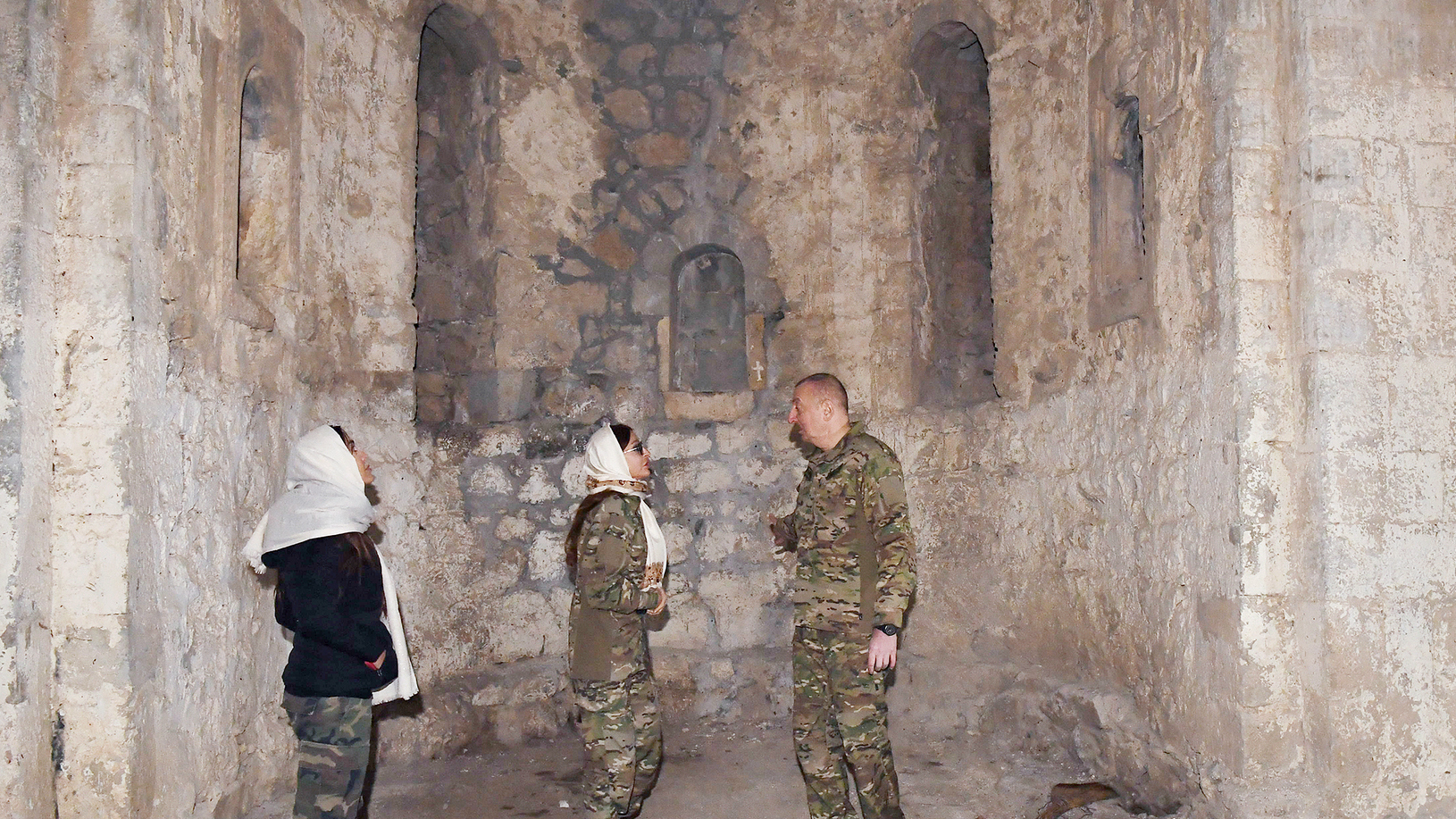 Azerbaijan President Ilhan Aliyev visits St. Astvatsatsin Church in newly controlled Nagorno-Karabakh with his wife and daughter in March 2021.