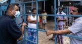 AGWO director Samuel Gift Stephen talks to migrant workers in a Singapore factory-converted dormitory to find out their needs during lockdown in April 2020.