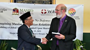 Nahdlatul Ulama leader Yahya Cholil Staquf presents World Evangelical Alliance leader Thomas Schirrmacher with a festschrift at The Nation's Mosque in Washington, DC, during the 2021 International Religious Freedom Summit.
