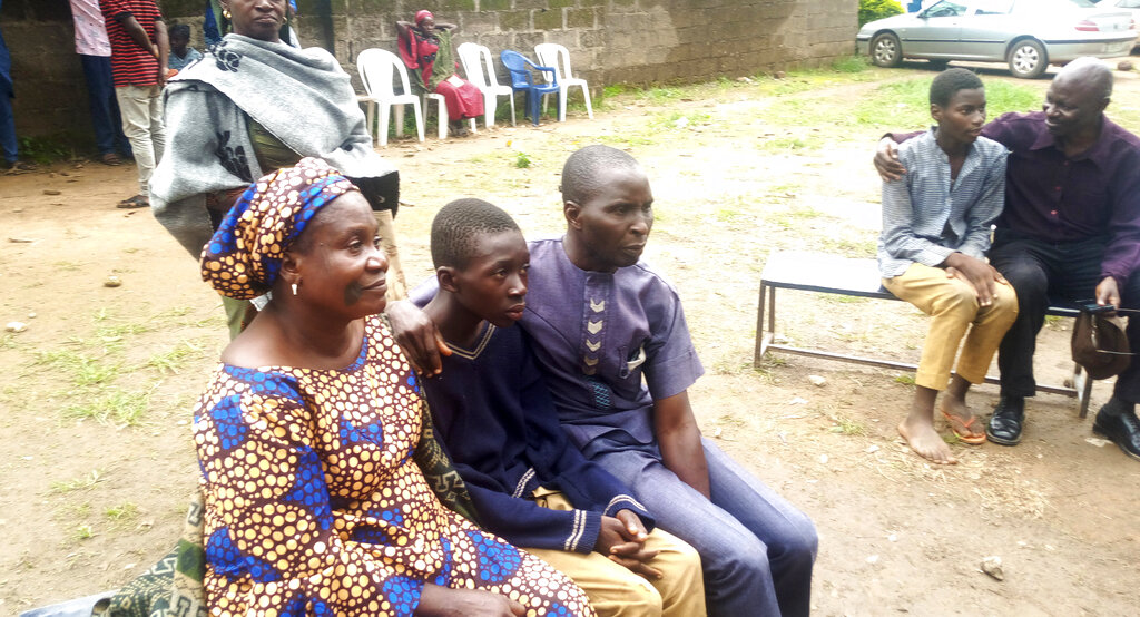 Parents are reunited with released students of the Bethel Baptist High School in Damishi, Nigeria, on Sunday, July 25.