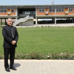 Chaldean Catholic Archbishop Bashar Warda stands in front of the Catholic University of Erbil, located in the Iraqi Kurdistan capital city's Ankawa district.