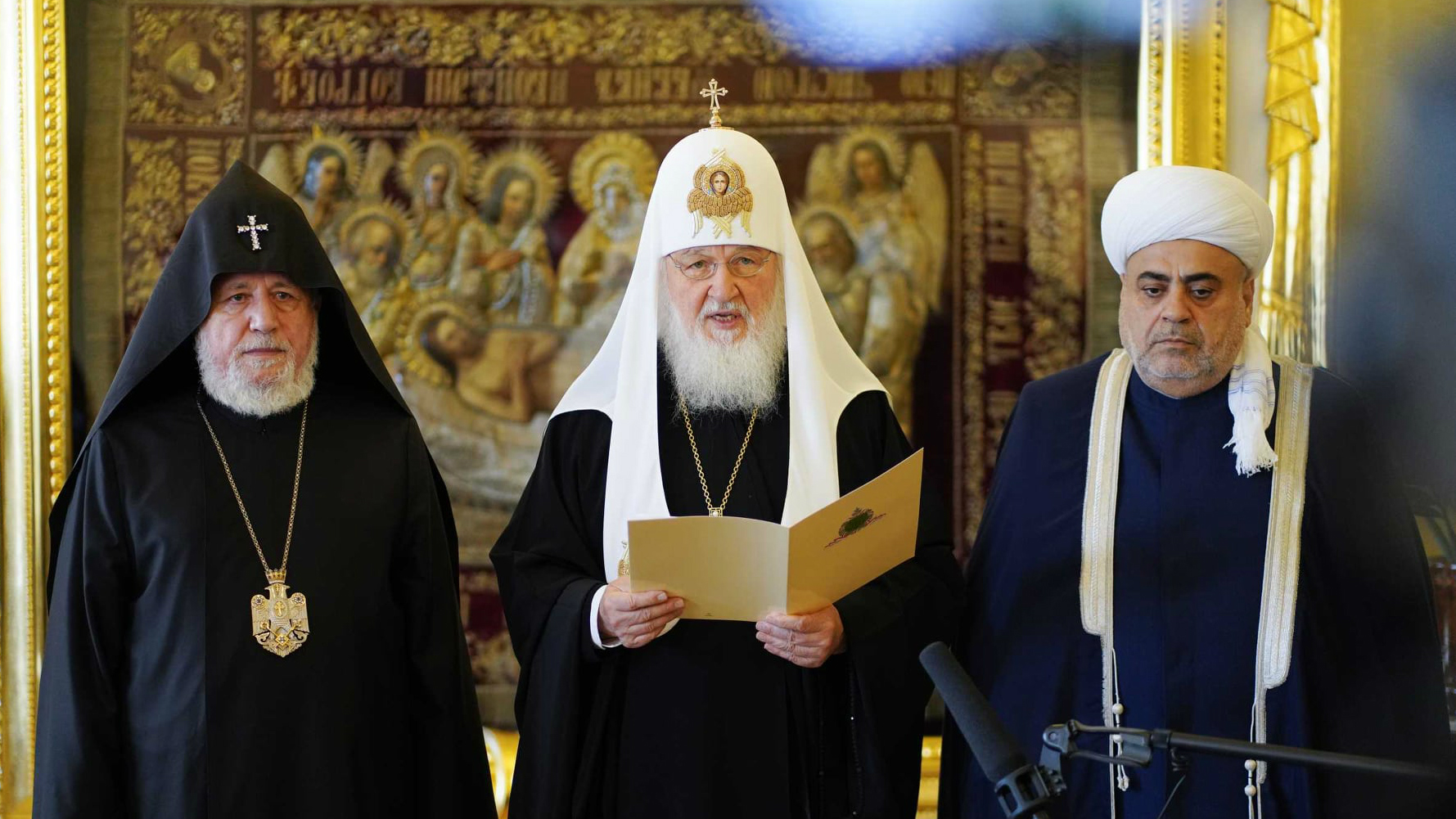 Russian Orthodox Patriarch Kirill I reads a joint statement flanked by Armenian Catholicos Karekin II (left) and Azerbaijan Grand Mufti of the Caucasus Allahshukur Pashazade (right) in Moscow on October 13.