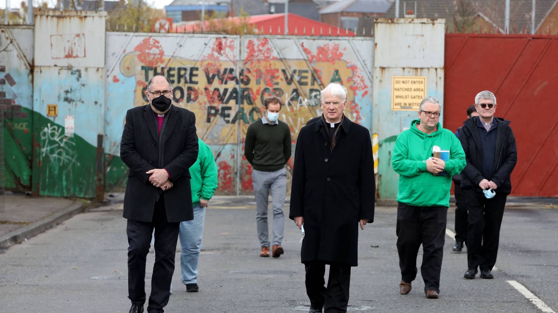 Church leaders from both communities gather at the peace wall in West Belfast in April 2021.
