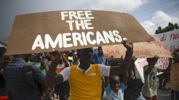 Haitians protest for the release of kidnapped American and Canadian missionaries near the Christian Aid Ministries headquarters in Titanyen, north of Port-au-Prince, Haiti, on Tuesday, October 19, 2021.