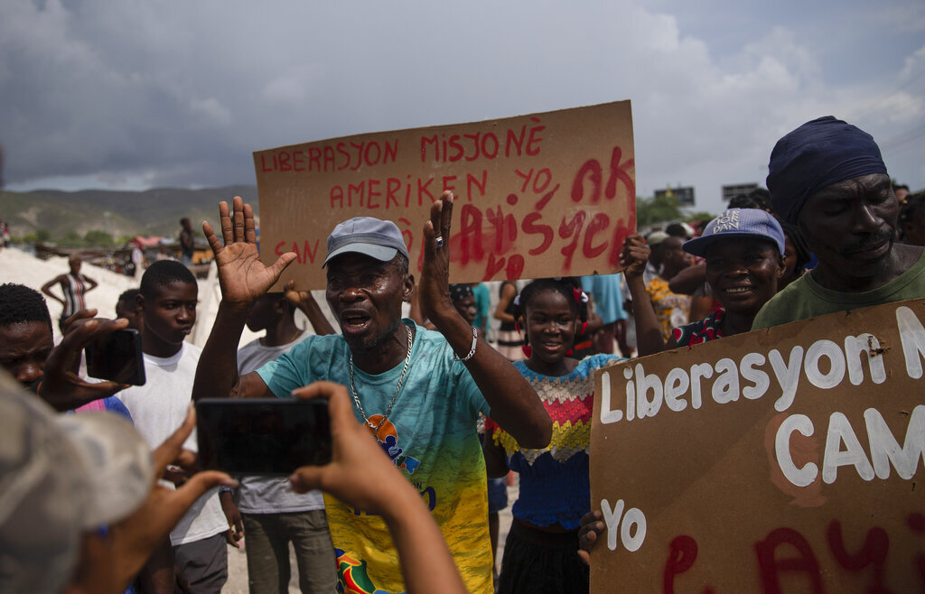 Haitians protest for the release of kidnapped missionaries near the Christian Aid Ministries headquarters in Titanyen, north of Port-au-Prince, Haiti, on Tuesday, October 19, 2021.