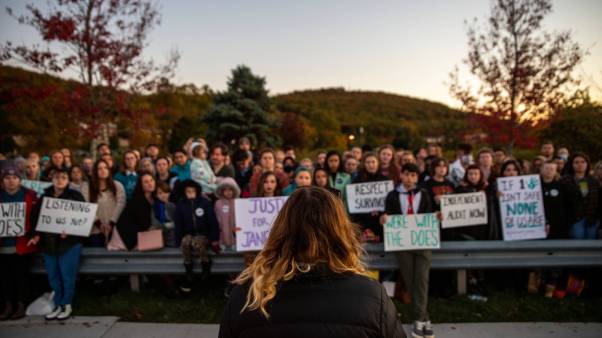 Hailey Wilkinson, Justice for Janes representative and Liberty senior, reads the story of Jane Doe 2 to the crowd during the November 4 rally.