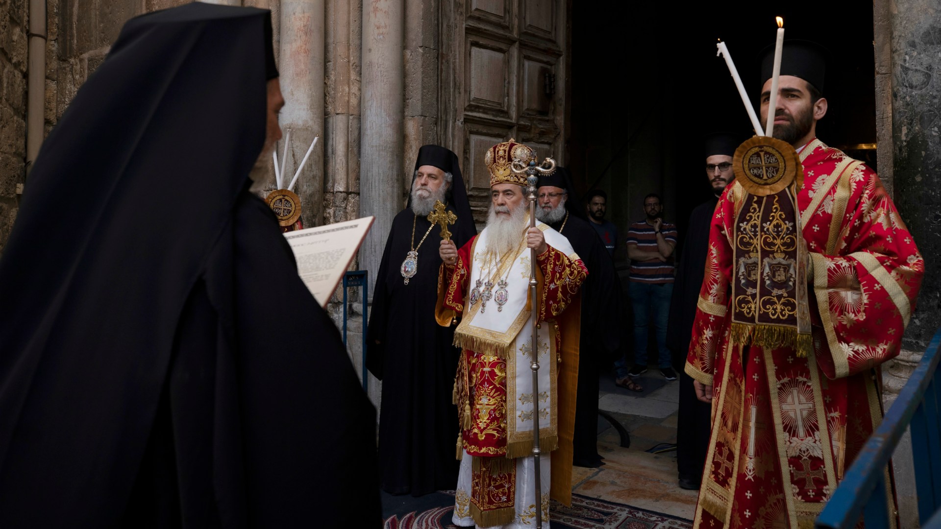 Greek Orthodox Patriarch of Jerusalem Theophilos III (center) walks in procession in the Old City of Jerusalem on April 29, 2021.