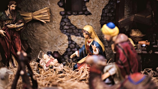 A manger scene with the focus on Mary and baby Jesus.