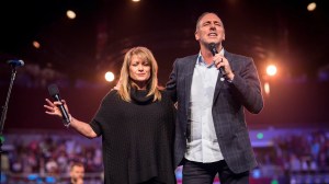 Senior pastors Brian and Bobbie Houston in prayer at Hillsong Church.